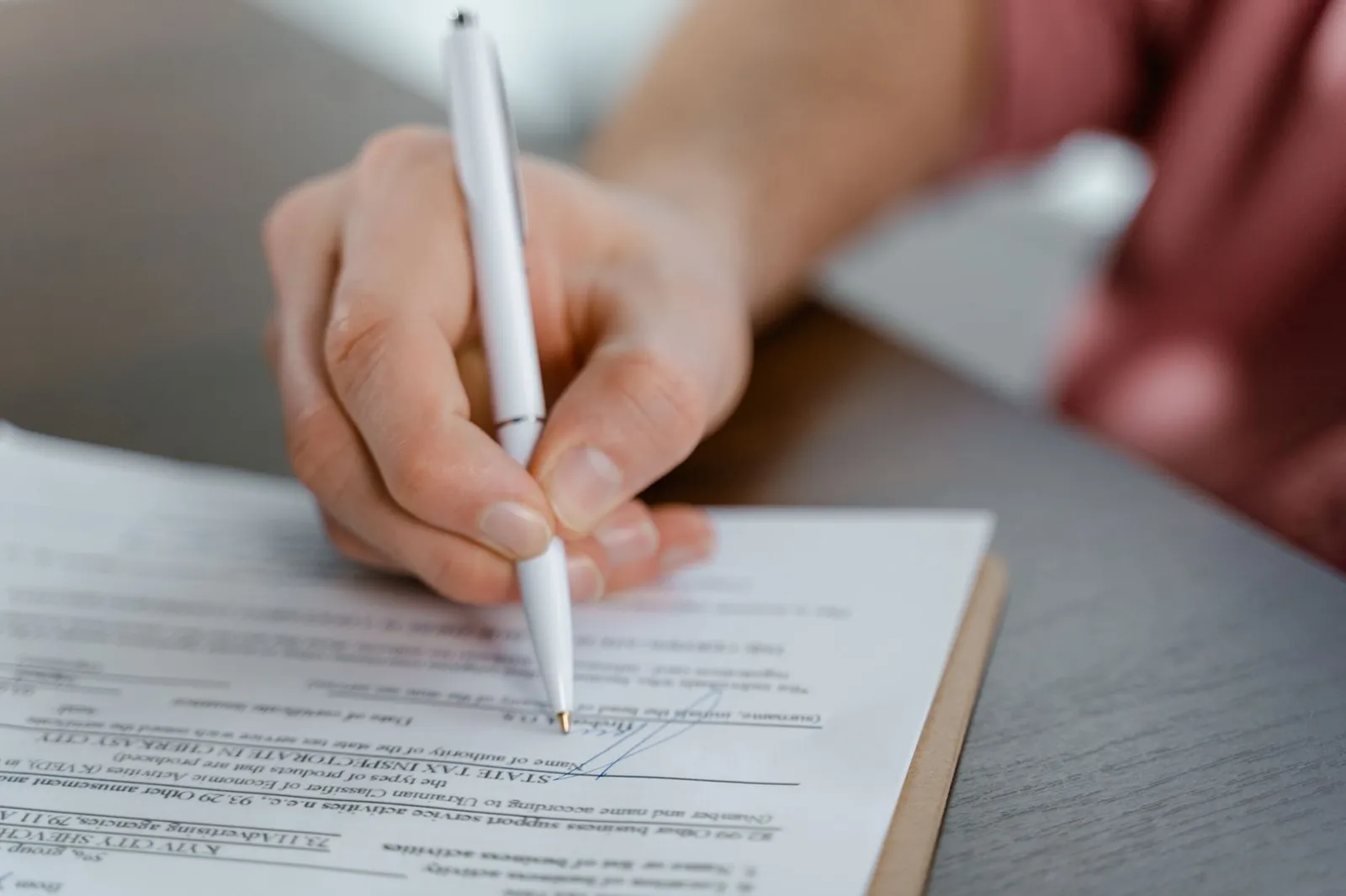 A signed Declaration of Conformity document on a desk.