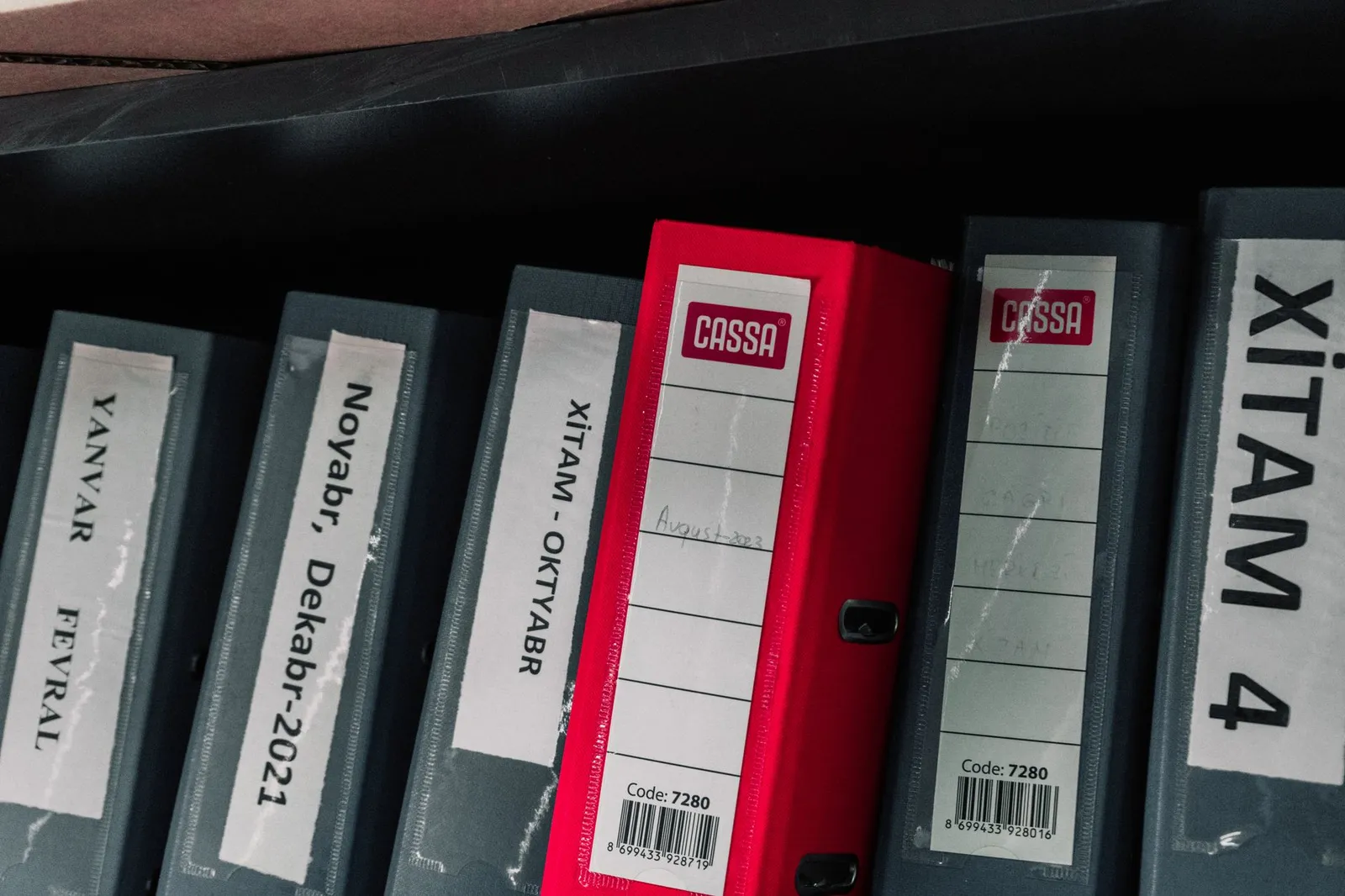A technical documentation file organized in a binder.