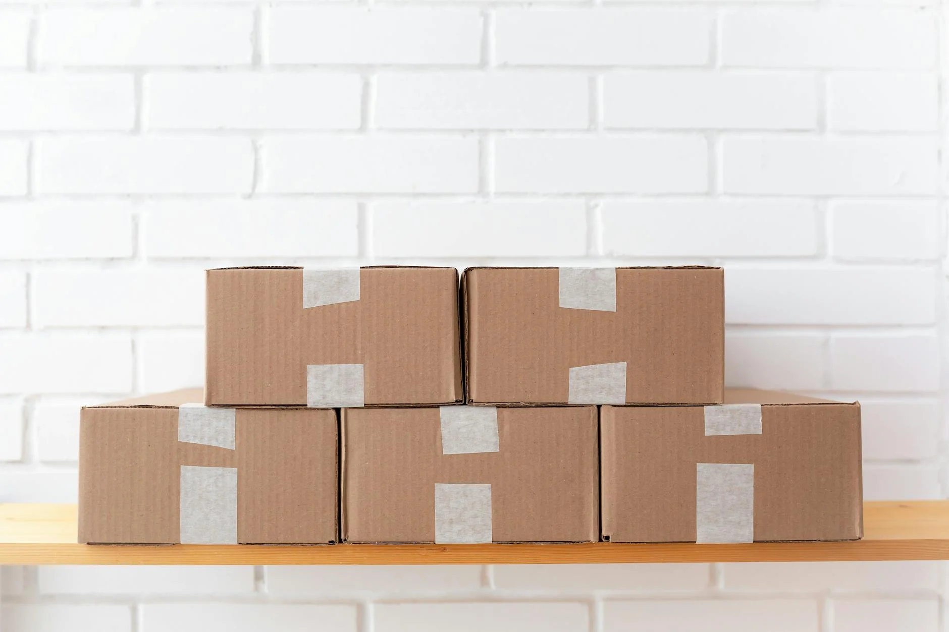 A stack of cardboard shipping boxes on a warehouse pallet ready for export